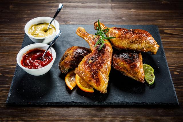 BBQ Chicken - Low Carb. Two servings of our tender grilled leg quarters are seasoned with house seasoning, basted with BBQ sauce, and served over sautéed spinach.  Our recipe is just as flavorful but much better for your nutrition, a new way to dish up this family favorite.