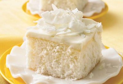 Classic Coconut Cake. Our moist and delicious slice of coconut cake is a taste you won't forget. Topped with our creamy coconut icing sprinkled with coconut shavings. Delicious desert!