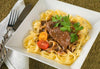 Braised Beef & Butter Noodles w/ Red Wine Reduction. This is the best braised beef over butter noodles in a red wine reduction.  A rich red wine reduction over tender steak strips and buttery noodles give this dish a rich and hearty flavor.  Enough for 2 servings.