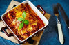 Our Classic Italian Lasagna is prepared with layered pasta sheets covered in a creamy mixture of parmesan and ricotta cheese, ground beef and Italian sausage with a sweet béchamel and savory marinara sauce. Topped with fresh mozzarella and parmesan cheese. This hearty, comforting dish is sure to be a family favorite. Hearty meals delivered to your door!