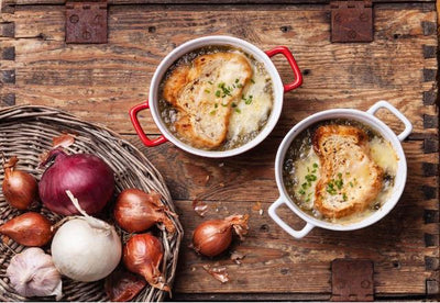French Onion Soup. Delicious sweet onions simmered to perfection in a savory beef broth, accented with a touch of sherry wine to give this classic soup a unique twist. Comes with a side of Swiss cheese and croutons.
