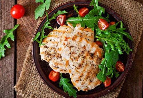 Sriracha Glazed Chicken. Sriracha chili sauce is the oh-so amazing sauce that heats up this new dish with flavor not fire.  We start with marinated chicken breasts in Sriracha before being grilled. We served this with tomatoes, sweet peppers, and crispy onions over spinach and arugula.  Truly an amazing dish!
