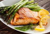 Almond Crusted Wild Salmon - Low Carb Our fresh wild salmon is light battered with crushed almonds and seasoning and served with asparagus, served over kale is a healthy, low fat and low sodium dish, that is rich in flavor and generous in size. We source our salmon from the Faroe Islands, ﻿