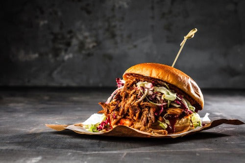 BBQ Brisket Sandwich with Lemon Pepper Slaw. Our BBQ Brisket Sandwich are made with slow smoked brisket sliced and basted with our BBQ sauce on our delicious brioche bun. We serve shredded slaw with a side of our lemon pepper ranch.