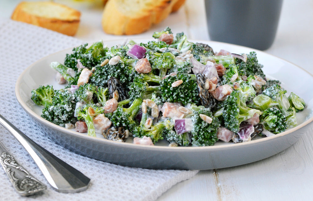 Broccoli Crunch Salad. Fresh broccoli tossed with low fat mayonnaise, dried cranberries, and nuts creating a flavorful side salad to any the dish.