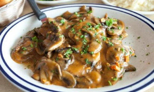 Baked Madeira Smothered Chicken - Low Carb. Our organic chicken breasts are baked and smothered with our country Madeira red wine mushroom gravy. This delicious chicken is served with green beans.  This lighter version recipe is the best way to enjoy great food that is actually good for you. You will love this low calorie and low carb dish!