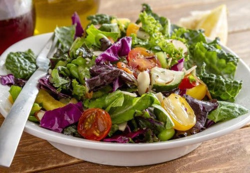 Our Dinner Salad Bowl comes with organic mixed greens,  croutons, cherry tomatoes, and cucumbers. This light salad is served with our Homemade Champagne Vinaigrette Cup on the side. Light, delicious!