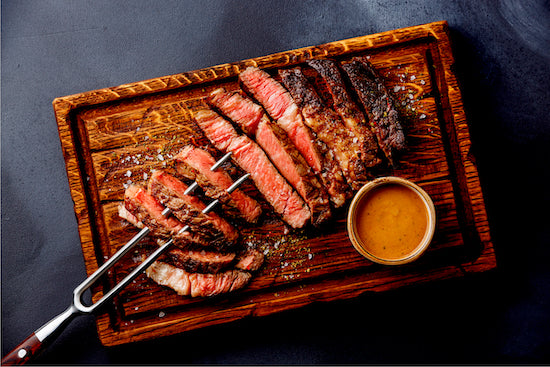 Our juicy skirt steak is bursting with juicy rich flavor. Marinated overnight for outstanding flavor with exceptional marbling and tenderness.  Our skirt steak is served rare with cognac peppercorn sauce, roasted asparagus and seasonal veggies. Low carb meal.
