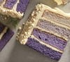 Blueberry Ombre Cake. You will love this decadent blueberry ombre cake, four layers of delicious moist cake are framed with sweet vanilla icing, one slice per order.