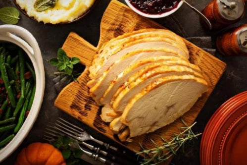 Our oven sliced roasted turkey dinner is packed with sliced breast meat, mashed potatoes, green beans, and country brown gravy. We brine our turkeys overnight and slow roast for perfect tenderness.